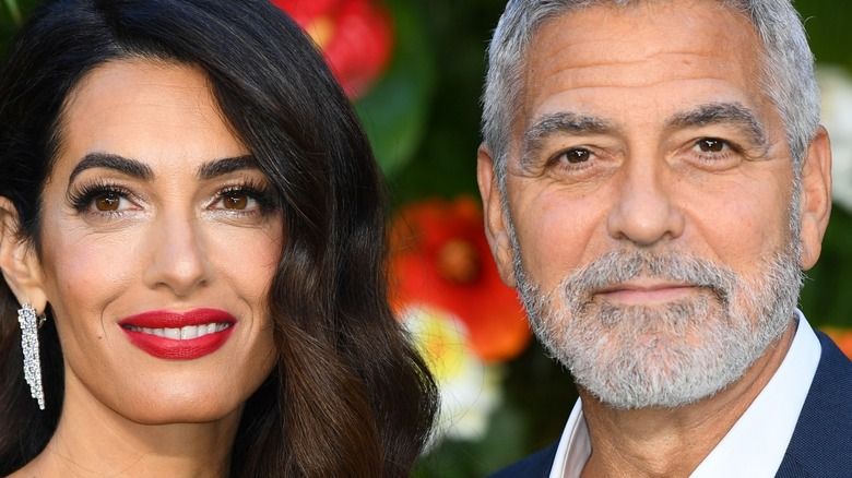 Amal Clooney und George Clooney lächeln